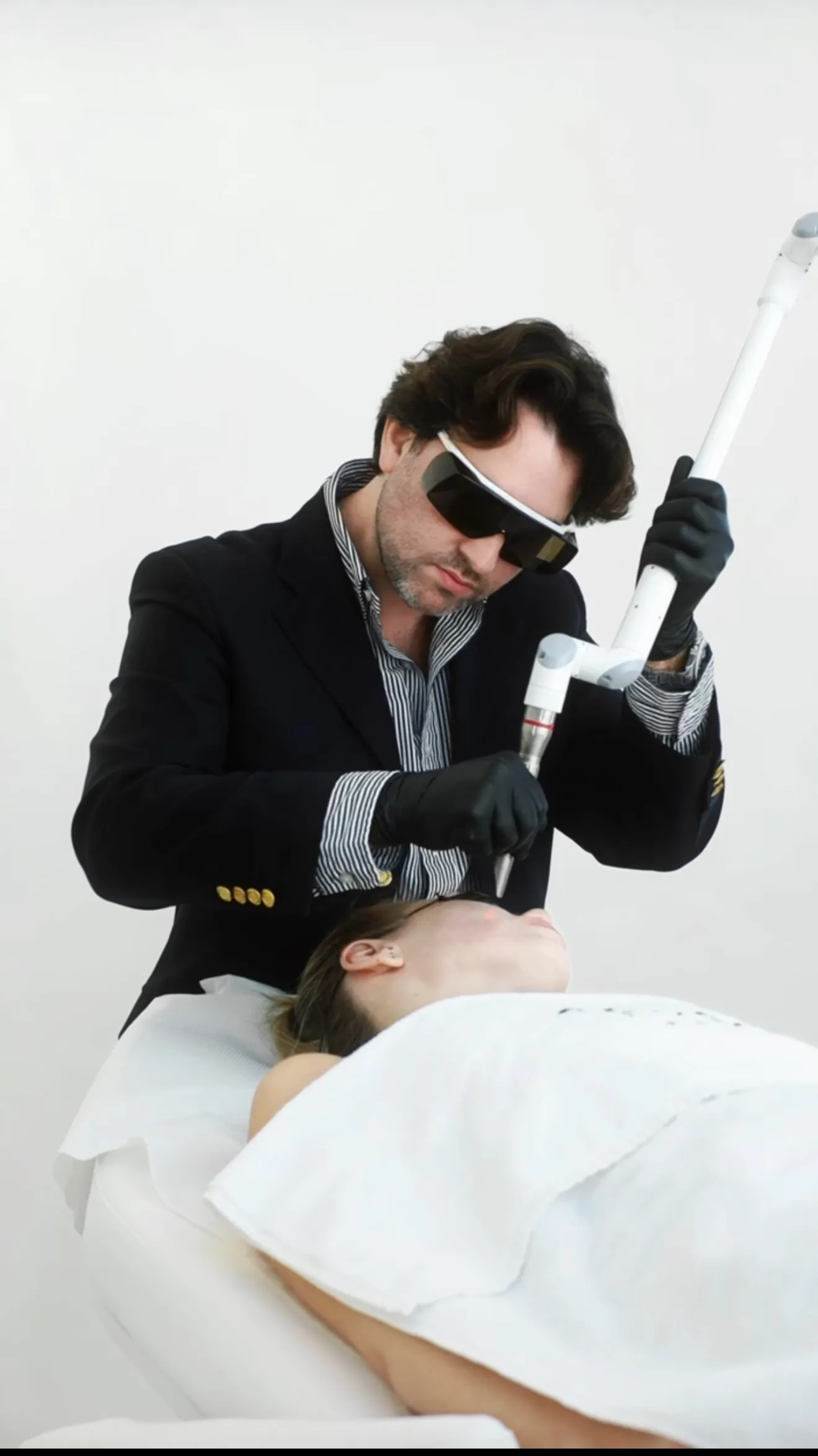 Doctor performing a laser treatment
