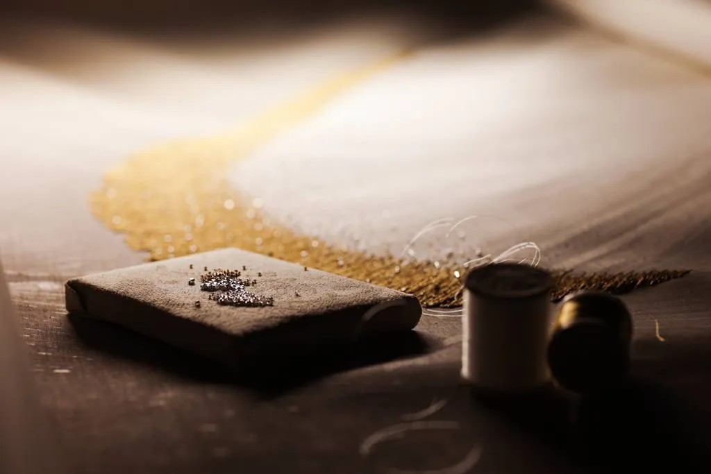 Gold bead embroidery on silk, behind the scenes